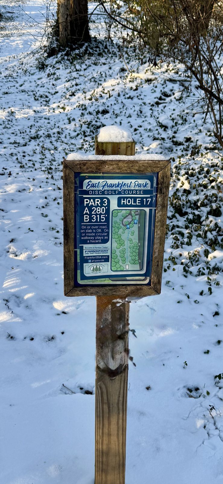 East Frankfort Park hole 17 tee sign in snow, Par 3, 280 and 315 feet, FDGA